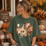 Floral turkey DTF transfer with hand-painted fall flowers, a bow, and autumn colored feathers on a green shirt