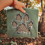 Distressed paw print DTF transfer with faux ripped fabric edges revealing leopard print design underneath