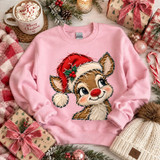 Reindeer in Santa hat Christmas DTF transfer with faux-embroidery stitched style on a pink sweatshirt