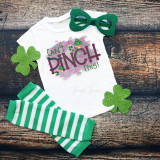 Can't pinch this St. Patrick's Day Sublimation Transfer, a colorful design on a white T-shirt with green and purple lettering and shamrocks, surrounded by green striped socks, green glitter shamrocks, and green glasses for St. Patrick's Day celebration.