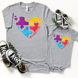 Puzzle Heart Autism Awareness FINAL STOCK-INFANT Screen Print Heat Transfer T-shirts for kids, featuring colorful puzzle piece heart design with smaller purple hearts on a gray background