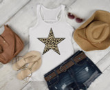 Leopard Star Sublimation Transfer, a star-shaped leopard print design on a white tank top, surrounded by summer accessories including sandals, a straw hat, sunglasses, a brown handbag, and denim shorts, on a white wooden surface.