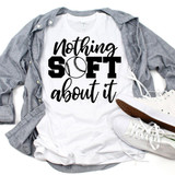 Nothing Soft About It Softball Sublimation Transfer, graphic T-shirt with softball graphic and sporty text, laid flat with casual sneakers and a gray shirt to showcase the sports-themed apparel.