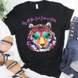 Hey All You Cool Cats & Kittens FINAL STOCK Screen Print Heat Transfer, black T-shirt with a colorful tiger wearing sunglasses with palm trees reflected in the lenses.