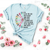 Give Me The Beat Boys and Free My Soul Screen Print Heat Transfer, light blue T-shirt with music note and guitar graphic and song lyrics, laid flat with pink flowers and green leaves around.