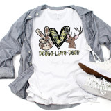 Peace Love Deer Sublimation Transfer, graphic T-shirt with peace sign, deer and heart design, casual white shirt with sneakers and grey shirt layered on top.