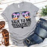 Talk To Me Goose Screen Print Heat Transfer on a gray T-shirt featuring sunglasses with a sunset and palm trees design.