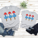 USA Bomb Pop YOUTH Screen Print Heat Transfer, set of two gray T-shirts with patriotic popsicle designs and blue 'USA' letters for kids.