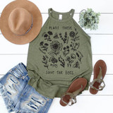 Plant These Save the Bees Screen Print Heat Transfer, illustrated image of a sleeveless green top with black floral plant designs and bee illustrations, laid flat alongside a tan hat, distressed denim shorts, brown sandals, and a small potted plant.