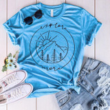 Explore More Screen Print Transfer, blue T-shirt with mountain and sun graphic and the words "explore more" printed on it.