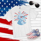 George Washington Patriotic Firework Sunglasses Sublimation Transfer, graphic t-shirt featuring an illustration of George Washington with patriotic sunglasses and firework design, American flag-themed sneakers and sunglasses on a patriotic background.