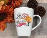 Autumn Vibes Sublimation Transfer, white ceramic mug with autumn-themed design including a red truck, fall leaves, trees, and the words 'Autumn Vibes'.