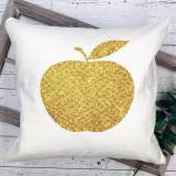 Golden Apple Sublimation Transfer, glittering gold apple design with geometric pattern on a white pillow.