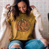 Leopard Orange Glitter Look Pumpkin Screen Print Heat Transfer, woman wearing autumn-themed T-shirt with glitter pumpkin design.