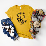 Just The Tip Screen Print Transfer, yellow T-shirt with black graphic design and text, jeans, plaid scarf, and cotton branch accessories displayed on a white background.