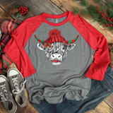 Shaggy Cow Hat Screen Print Heat Transfer, a graphic design of a cow wearing a Christmas hat with horns decorated with holly.