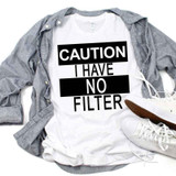 Caution I Have No Filter Sublimation Transfer, T-shirt with bold black and white text design laid on a gray shirt with white sneakers nearby.