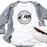 He Man Woman Haters Club Sublimation Transfer, white t-shirt with black circular logo design and text, casual clothing style with gray shirt and white sneakers.