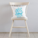 Let It Snow Somewhere Else Sublimation Transfer, white decorative pillow with blue winter-themed text and snowflake designs on a white chair.
