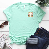 Brushstroke Cross POCKET Screen Print Heat Transfer, mint green T-shirt withprint design on the chest.