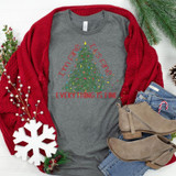I'm Fine It's Fine Everything Is Fine Christmas Screen Print Heat Transfer, Christmas-themed grey T-shirt with a holiday tree and colorful lights design, displayed with winter accessories and decorations.