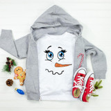 Snowman Face Sublimation Transfer, a cute snowman face design on a white T-shirt with a gray hoodie, surrounded by Christmas decorations and shoes.