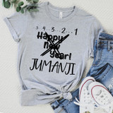 3 2 1 Jumanji FINAL STOCK Screen Print Transfer T-shirt, grey casual shirt with black printed design celebrating New Year, with jeans and white sneakers in flat lay.