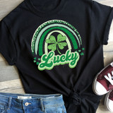 Lucky Rainbow St. Patrick's Day Screen Print Heat Transfer, a black t-shirt featuring a green rainbow and a four-leaf clover with the word 'Lucky' in bold cursive font.