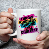 Throw Kindness Around Like Confetti Sublimation Transfer, colorful printed design on a white ceramic mug.