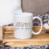 Grow In Grace Sublimation Transfer, white ceramic mug with colorful flower design and the phrase 'grow in grace'.