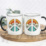 Peace Sign Mountain Scene Sublimation Transfer, two white mugs with black handles featuring a mountain landscape with sunset, water, and trees inside a peace sign design.