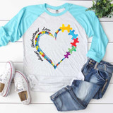 Accept Understand Love Sublimation Transfer, graphic of a colorful heart with puzzle pieces and the words 'Accept Unstand Love' on a casual gray and turquoise raglan t-shirt.