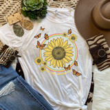 Free Spirit And Kind Soul Sublimation Transfer, T-shirt with sunflower and butterfly design, colorful rainbow, surrounded by accessories like jewelry, hat, and zebra print wallet.