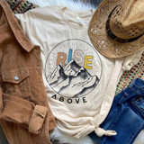 Rise Above Screen Print Heat Transfer, graphic t-shirt with mountain design and motivational text 'Rise Above' laid out among fashion accessories.