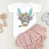 Shaggy Cow Easter INFANT Screen Print Heat Transfer, infant's white onesie with a colorful cow graphic wearing bunny ears and a bow, paired with pink ruffled shorts, suitable for Easter celebrations.