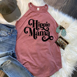 Hippie Mama Screen Print Heat Transfer, pink sleeveless top with 'Hippie Mama' text in black, casual denim jeans, green cap, boho jewelry and accessories on white faux fur background.