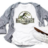 Teaching Is A Walk In The Park Camo Print Sublimation Transfer, t-shirt with dinosaur and camouflage design with text.