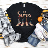 The Slayers Screen Print Heat Transfer, black t-shirt featuring a graphic of characters from The Beatles' Abbey Road album crossing the street.