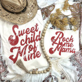 Rock Me Mama YOUTH FINAL STOCK Screen Print Heat Transfer, close-up of distressed red text on white fabric with beige accessories and floral background.