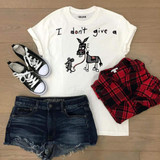 I Don't Give A Rat's Ass Sublimation Transfer, T-shirt featuring a cartoon donkey and mouse with humorous text, paired with casual clothes and sneakers.