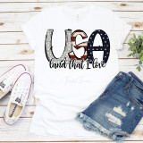 USA Land That I Love Patriotic Stars and Stripes Sublimation Transfer T-shirt, white T-shirt with patriotic USA-themed design of the word 'USA' featuring stars and stripes pattern and the phrase 'land that I love'.