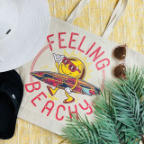 Feeling Beachy Surfboard Screen Print Heat Transfer, colorful beach-themed printed fabric with a surfing sun character wearing sunglasses, holding a surfboard, on a tote bag, surrounded by accessories like sunglasses and plants.