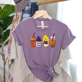 Hocus Pocus Lattes DTF Heat Transfer, purple t-shirt with colorful latte designs featuring themed text and imagery.