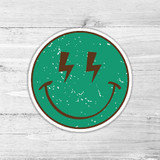 Green Lightning Smiley Retro Die Cut Sticker, circular green sticker featuring a smiling face with lightning bolt eyes and a vintage distress effect.