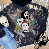 Floral Horror DTF Transfer, artistic Halloween-themed floral design with horror masks and butterflies on black hoodie fabric.