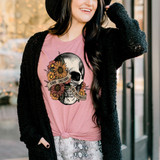 Kinda Emotional Kinda Emotionless DTF Transfer, a woman wearing a pink T-shirt with a skull and floral design and the words 'Kinda Emotional Kinda Emotionless' printed on it.