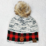 Reindeer Leather Patch, knitted winter hat with a faux fur pom-pom and reindeer leather patch detailing.