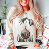 Merry Christmas Bulb Screen Print Heat Transfer, festive holiday mood with Christmas sweater featuring a skeleton hand hanging a decorated ornament with the words "Merry Christmas" on it.