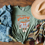 Pour Some Gravy On Me DTF Transfer, a graphic T-shirt with a cartoon gravy boat character and playful text design.
