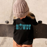 Howdy Happy Face YOUTH Screen Print Heat Transfer, a blue t-shirt with a cheerful face design and the word 'HOWDY' printed on it, worn by a young girl holding a skateboard.
